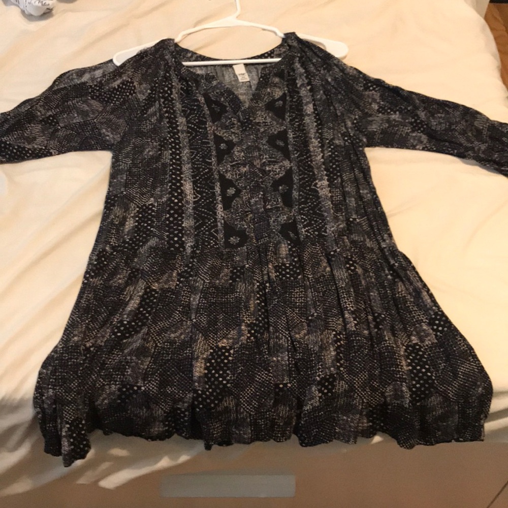 Patterned black shirt.